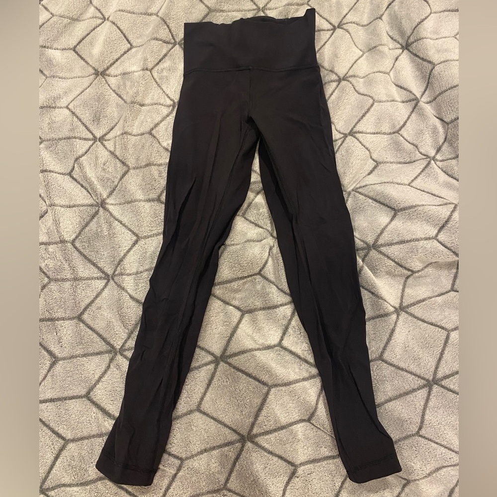 Black lululemon leggings with rose mesh details